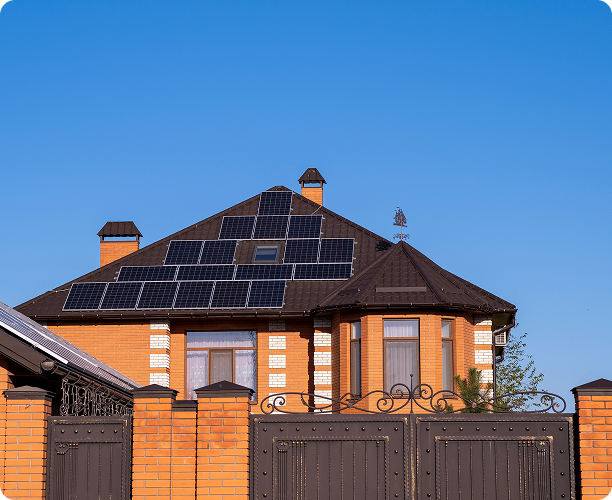 house-with-brown-metal-roof-solar-panels-fence-house-made-stone