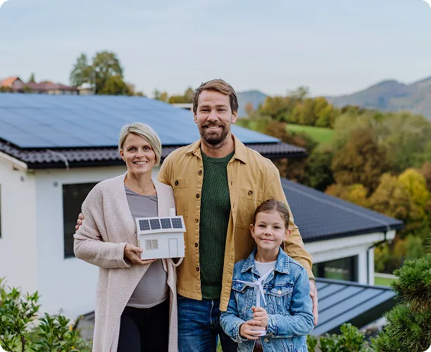 happy-family-holding-paper-model-house-with-solar-panelsalternative-energy-saving-resources-sustainable-lifestyle-concept